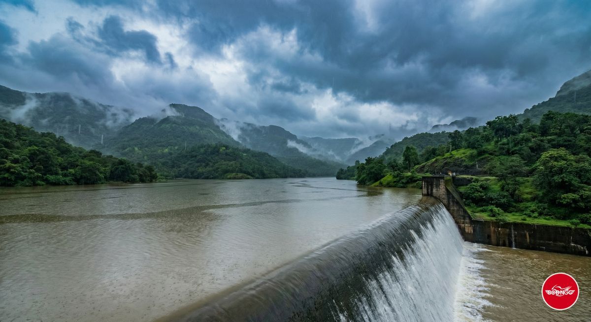 Bhira Dam scenic view with water overflowing during monsoon and green hills
