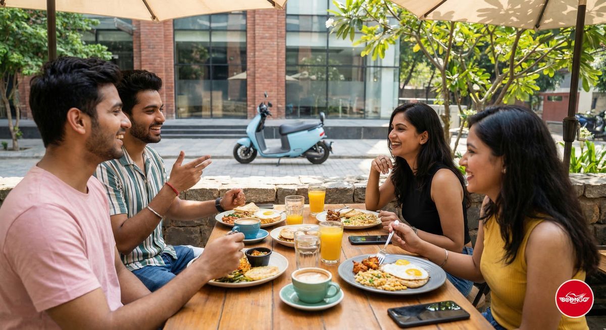Friends enjoying brunch at outdoor cafe in Baner Pune with scooty parked outside