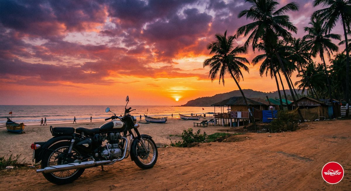 Goa beach sunset with motorcycle parked near palm trees and orange sky