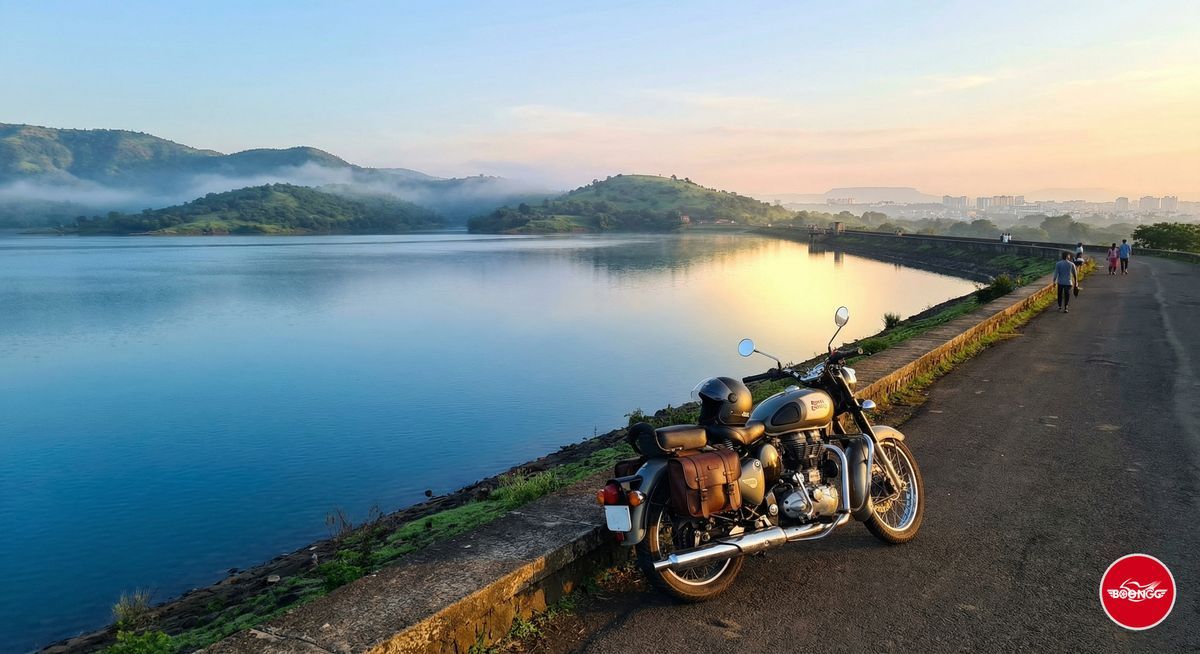 Khadakwasla Dam with calm blue water and green hills on Sinhagad road