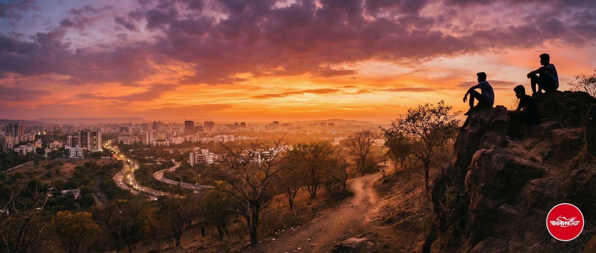 Stunning sunset view from Vetal Tekdi hilltop overlooking Pune city skyline