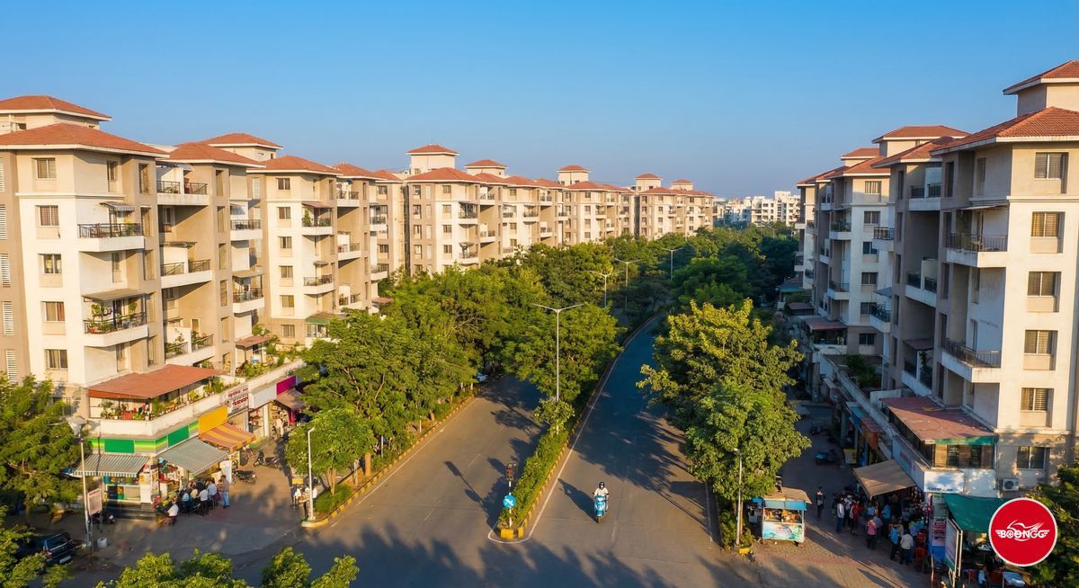 Aerial view of Wakad suburb in Pune showing apartment buildings and tree-lined roads
